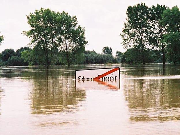The 1997 flood in Stary Dwór, Poland, with a town sign almost submerged